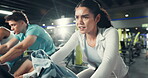 Spin class, fitness and tired with woman in gym for cycling machine, wellness and cardio fatigue. Stationary bike, exercise and exhausted with person in sports center for training, health and club