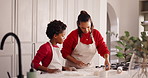 Baking, teaching and mom with kid in kitchen for bonding with preparing pastry for cookies. Happy, learning and mother with boy child for cooking food together with development in family home.