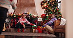 Smile, African family and children for Christmas celebration, gift giving and festive season. Happy, parents and kids running to presents, xmas tradition or Santa surprise of bonding together in home