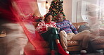 Tablet, parents and children running for Christmas shopping, play or motion blur in family home. Tech, mom and dad with kids in lounge with energy, hyper active or happy for xmas purchase on holiday