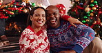 Christmas, hug and African couple with face, tree and love in living room of house together. Portrait, smile and man with woman, xmas and holiday or vacation bonding for festive season or tradition