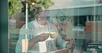 Coffee, laptop and thinking with man at cafe window for online research, remote work or vision. Computer, glass and idea with mature freelance employee drinking beverage in restaurant as customer
