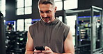 Smile, mature man and phone at gym for social media, fitness app and sign up on web. Happy, male person and mobile for program research, review progress and online notification of sports membership