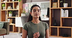 Burning incense, meditation and smoke with woman in home living room for balance or inner peace. Aroma stick, yoga and zen with person in apartment for aromatherapy, mindfulness or holistic healing