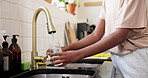 Home, hands and woman with tap water in glass for hydration, natural nutrients and thirsty. Kitchen, person and pour liquid at faucet for refreshing drink, fresh beverage and body detox for wellness