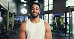 Smile, fitness and face of man in gym with workout, training or challenge with confidence. Happy, wellness and portrait of male athlete from Mexico with pride for exercise with health in sport center