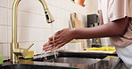 Woman, kitchen and washing hands with water in sink for hygiene, cleaning or disinfection in home. Closeup, female person or splash with tap in basin for rinse, germ or bacteria removal in house