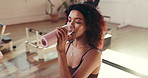 Happy woman, fitness or drinking with water bottle for hydration, rest or recovery in gym. Break, female person or smile with mineral liquid or thirst for natural sustainability in health club