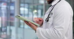 Man, doctor and hands with tablet for medical research, study or teleheath app in hospital. Male person, healthcare worker or employee browsing with technology or scroll for online results in clinic