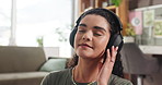 Relax, music and listening with woman in home for peace, zen podcast and streaming. Online radio, guided meditation and connection with person and headphones in living room of apartment for calm