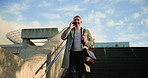 Happy, businessman and walking with phone call on stairs for conversation or discussion in city. Man, employee or talking with mobile smartphone on staircase for travel or commute to work in town