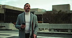 Commute, phone and thinking with businessman in city to check agenda or schedule for travel. App, communication and planning with mature employee walking outdoor in urban town for job or work