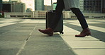 Person, walking or legs with suitcase for business travel, work trip or commute in city. Feet, traveler or shoes with luggage for company journey, immigration or new job opportunity in an urban town