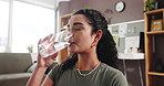 Break, drinking water and fitness with woman in home living room for exercise, health or wellness. Glass, hydration and thirsty with person in apartment for awareness, balance or holistic healing