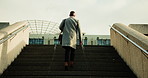 Back, business and man with stairs, below or urban town with morning commute, mission and walking. Outdoor, person and professional with steps, journey and travel with career progress in New York