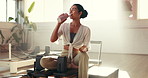 Pilates class, woman and drinking water for fitness, nutrition or smile for wellness. Gym, hydration or thirsty person with bottle for liquid, diet or detox beverage on break with reformer for health