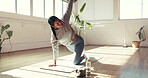 Exercise, stretching and yoga with woman in studio for health, holistic routine or wellness. Fitness, flexibility and hand raised with yogi person on wooden floor for balance, development or practice