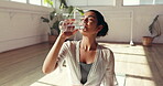 Break, drinking water and yoga with woman in studio for health, exercise or wellness. Fitness, hydration and recovery with happy yogi person in class for healing, holistic routine or pilates