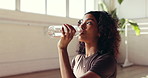Drinking water, thinking and yoga with woman in studio for health, exercise or wellness. Break, fitness and hydration with yogi person in pilates class for healing, holistic routine or recovery