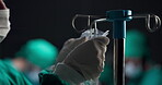 Hands, iv drip and surgery with doctor in hospital, getting ready for operation or procedure. Healthcare, medical and set up with surgeon in operating room of dark clinic for intravenous infusion