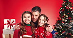 Christmas, face and father hug children for love, care or support on red studio background. Xmas, dad and embrace happy girls, kids or sisters with parent for holiday celebration with family portrait