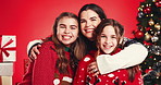 Christmas, face and mother hug children for love, care or support on red studio background. Xmas, mom and embrace happy girls, kids or sisters with parent for holiday celebration with family portrait