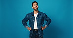 Fashion, happy and thinking with man on blue background for artistic inspiration or clothing ideas. Denim, opportunity and vision with smile of clothes designer on studio space for outfit planning
