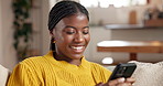 Black woman, living room and laugh with phone, typing and social media for funny meme on home sofa. African person, couch and mobile app with smile, online dating or message in apartment lounge