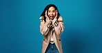 Face, shocked and woman in studio, smile and announcement on blue background. Portrait, space and person with facial expression, surprise or good news with winner, omg or discount deal with success
