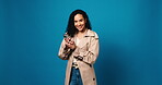 Phone, laughing and face with woman in studio for social media meme, networking and connection. Communication, notification update and joke with person on blue background for space and internet