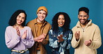 Gen z friends, face and applause in studio with smile, celebration and success on blue background. Men, women and group portrait for university students with cheers, excited and goals with motivation