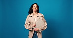 Woman, laptop and smile on face in studio, pride or done with research for story on blue background. Person, portrait and mockup space for report, article or finish draft for newsletter in Colombia