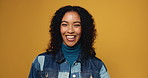 Face, funny and woman in studio, laughing and joke with happiness on yellow background. Portrait, space and cheerful person with humor, comic and smile with positive energy, good news and mindset