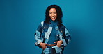 Face, woman and laughing for fashion in studio of casual clothes, positive attitude and minimalistic. Mockup space, person and confidence with apparel, trendy outfit and cool style on blue background