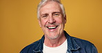 Mature, happy man and face with laugh in studio for funny joke or comedy on a orange background. Portrait, male person or smile with positive attitude or expression for comic or humor on mockup space