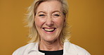 Face, mature woman and smile in studio for funny joke, comic story and stress free. Portrait, female person and happy with laugh, positive attitude and expression with good mood on yellow background