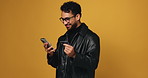 Happy man, phone and online shopping with credit card in studio for payment on a orange background. Male person, shopper or model with mobile smartphone, debit or smile for ecommerce on mockup space