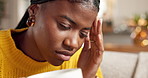Coffee, pain and black woman with migraine in home, sick or burnout with tea beverage. Drink, headache and person with stress in living room for tension, tired or massage temples for mental health