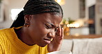 Coffee, stress and woman with migraine in home, sick or burnout with tea beverage. Drink, headache and black person with pain in living room for tension, tired or massage temple for mental health