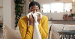 Home, fabric scent and black woman on sofa, folding laundry and satisfied in living room. Smelling, housekeeping and African person on couch, aroma and clean clothing with maintenance, pride or smile