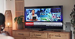 Person, watching tv and screen for news report with back for AI, surveillance or headlines at home. Television, broadcast and program for security, artificial intelligence info or future tech on show