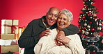 Christmas, smile and face of old couple in studio for love, holiday season and festive celebration. Romance, xmas and bonding with elderly man and woman on red background for tradition and hug