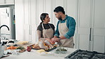 Cooking, food and couple in kitchen with turkey for meal prep, dinner and festive lunch. Thanksgiving, talking and man with woman with ingredients, recipe and meat for nutrition, dish and celebration