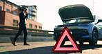 Road sign, vehicle breakdown or man with phone call in street for battery fail, stress or fuel issue. Warning triangle, business person or talking to mechanic for roadside assistance, stuck and help