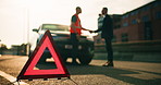 Handshake, hazard and roadside assistance with people outdoor for caution, fail or mistake. Breakdown, emergency service or warning triangle with driver and mechanic shaking hands for caution or help