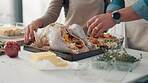Chicken, cooking and vegetables with hands of couple in kitchen together for recipe or roast dinner. Food, protein and salad with people closeup in apartment for diet, meal preparation or nutrition