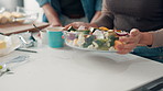 Cooking, hands and salad with couple in kitchen of home together for diet, health or nutrition. Bowl, food and vegetables with people in apartment for meal preparation or recipe process closeup