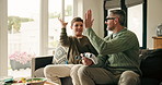 Father, boy and high five on sofa with video game controller, challenge and happy at family home. People, dad and child with teamwork, celebration or winner with competition, bonding or play at house