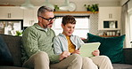 Help, family and son with tablet, father and support with smile, bonding together and social media. Parent, relax and boy on sofa, dad and tech with happiness, website info and game with app or home