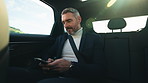 Business, man and reading on phone in car for communication, social media and travel to work. Mature person, mobile and passenger in vehicle with schedule update, funny notification and taxi location